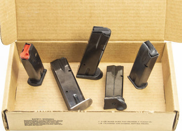 4 USED 9MM MAGS AND 1 USED .41 AE MAG